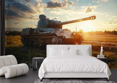 Military tank in the field at sunset. Wall mural