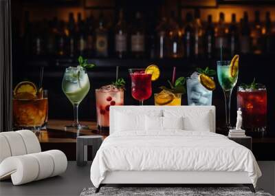 Variety of alcoholic drinks on bar counter. Colorful cocktails on dark background Wall mural