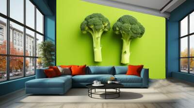 Two broccoli pieces arranged on background. Wall mural