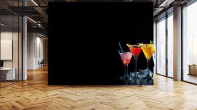 two glasses of champagne on black background Wall mural