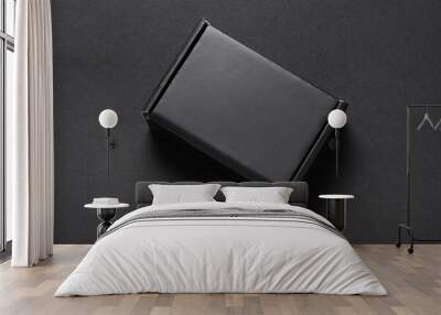 Black box on dark background, present, top view Wall mural