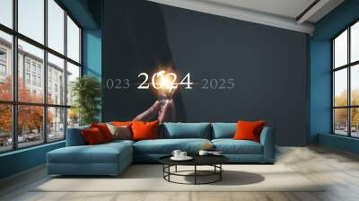 Startup concept. Man holding a light bulb. With a clear vision and strategic plan, a determined businessman navigates the trends of 2024, paving the way for a prosperous future. Wall mural