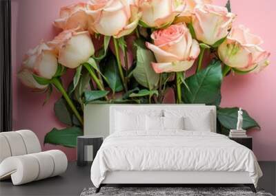 Bouquet of beautiful fresh roses with a card on a pink background, top view: Valentine's Day, Mother's day. Wall mural