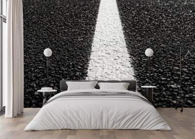 Close up of black asphalt road and white dividing lines Wall mural