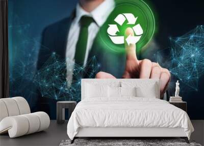 Businessman pointing at green recycle symbol or sign with his finger on digital display screen. Ecology and environment conservation and sustainability concept. Corporate company management  Wall mural