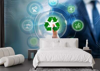 Businessman pointing at green recycle symbol or sign with his finger on digital display screen. Ecology and environment conservation and sustainability concept. Corporate company management  Wall mural