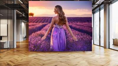 Beautiful healthy long hair. Back view of Young teen girl in hat over lavender field. Wall mural