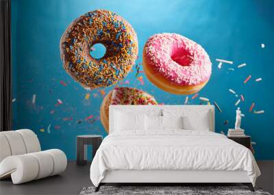 Colorful donuts. Isolated on white background Wall mural