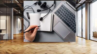 Female hands working on wooden work place with modern gadgets  Wall mural