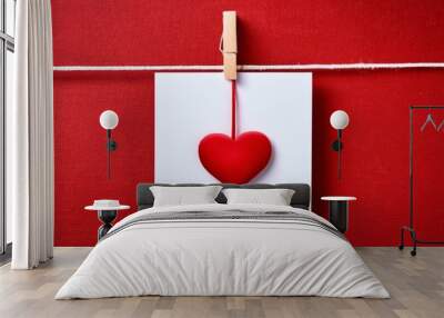 Valentine's Day. Red hearts hang on the rope. Wall mural