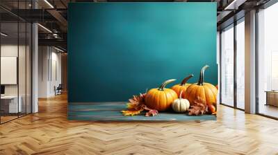 autumn thanksgiving background, pumpkins and maple leaves on turquoise table. generative ai Wall mural