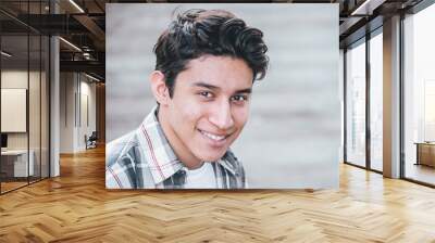 closeup of handsome young male smiling into the camera outdoors Wall mural