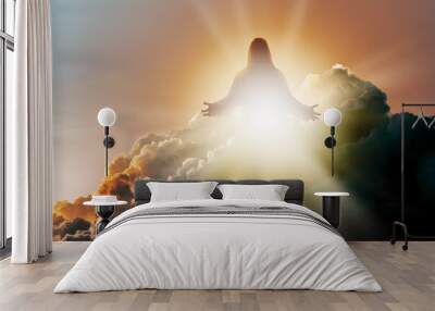 Silhouette of Jesus Christ in Heaven, up in the clouds against a bright ethereal light. Christian concept of salvation. Wall mural