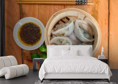 Steamed Prawn and Spring Onion dumplings in dim sum basket served with chili sauce and calamansi. Asian dimsum appetizer Wall mural