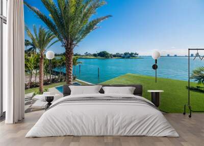 View of a nice pool and waterfront from terrace of a luxury home in Miami Wall mural