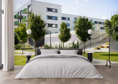 Modern apartment buildings in a green residential area in the city. Apartments in a new urban housing. Block of flats in beautiful green public park Wall mural