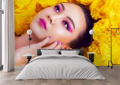 Colorful fashion makeup Asian woman with yellow flower. Wall mural