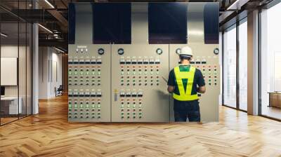 Electrical Engineer team working front control panel, Technician daily check control panel in service room in factory. Wall mural