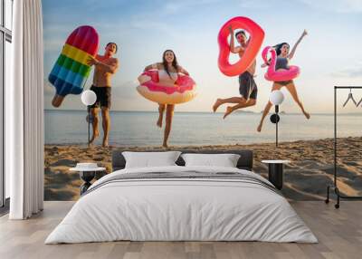  Holiday summer party with friends on the beach .Group of family and friends  jumping on the beach. lifestyle people vacation holiday on beach Wall mural