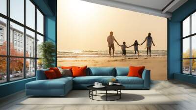 Asian family vacation at the beach with family relationships caused love and understanding to strengthen social immunity. Wall mural