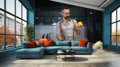 lifestyle man preparing food in the kichen Wall mural