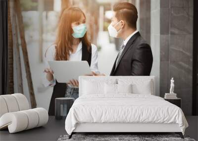 People pay attention to the virus alerts coming from contact. And the respiratory system, business man and women standing, wearing a mask Wall mural