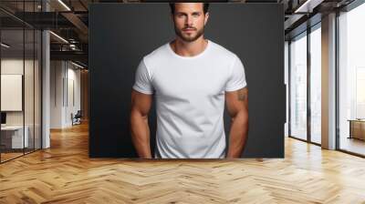 centered portrait view of a gorgeous man wearing a white blank t-shirt with a black seamless background mockup, body shot Wall mural