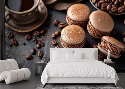 Dark and brown macarons, coffee powder on them, coffee smooth cream, on a dark marble table, coffee beans and a cup of coffee beside Wall mural