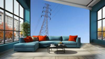 High voltage tower with blue sky background. High voltage pole. Wall mural