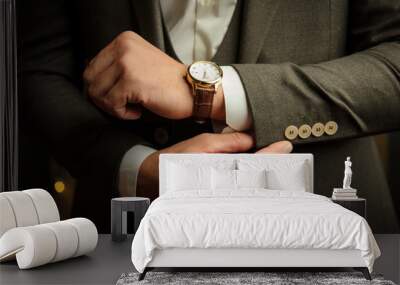 Close-up photo of a man with gold watch with a leather belt Wall mural