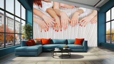 Many women hands with red nails Wall mural