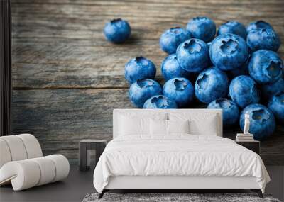 Sweet ripe blueberries on a wooden table, a healthy and natural treat Wall mural