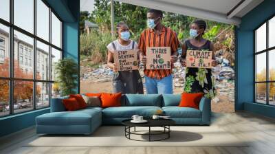 African youth protesting against climate change holding signs and wearing masks Wall mural