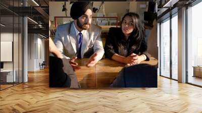 Group of Indian co-workers brainstorming during a business meeting Wall mural