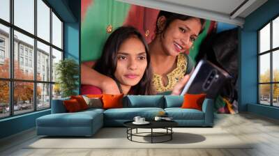 Young Indian female friends taking a selfie Wall mural