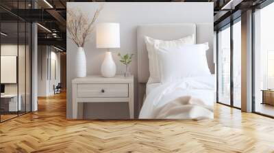 a bedroom with a double bed and a wooden bedside table in light colors and a lamp Wall mural