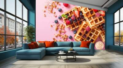 Two waffles with whipped cream and fruit toppings on a pink background. The waffles are served with a variety of toppings including bananas, strawberries, and nuts. Concept of indulgence and enjoyment Wall mural