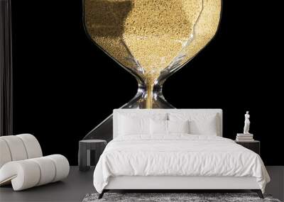 Elegant and stylish bronze transparent sandglass with trickling golden round particles. Stock footage. Sandglass isolated on black background, time, hurry up, last minute, no time concepts. Wall mural