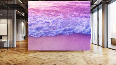 Tender dreamy pink sea waves on shore. Filtered color. Wall mural