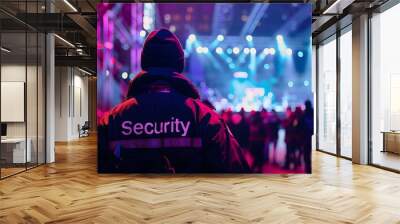 Close-up of a security guard's back with the word 