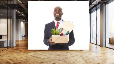 Portrait of African office worker holding box with personal belongings Wall mural