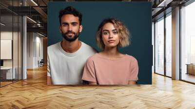 A man and a woman are standing next to each other, both wearing white shirts Wall mural