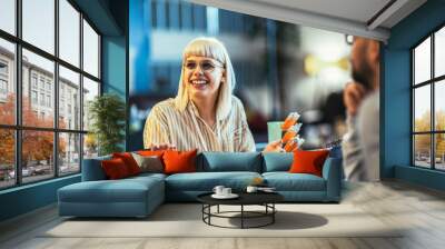  Creative young businesswoman sharing her ideas during a meeting in a modern office. Wall mural