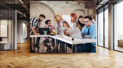  Group of young business people in smart casual wear working together in creative office Wall mural