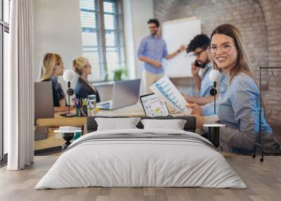 business colleagues in conference meeting room during presentation. businesswoman using laptop and l Wall mural