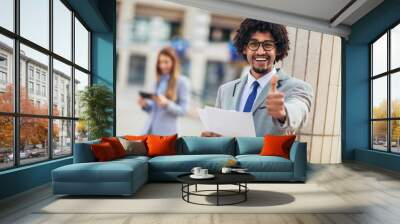 Cheerful african american business executive giving thumb up Wall mural