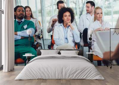 Group of doctors on seminar in lecture hall at hospital. Hospital, profession, people and medicine concept Wall mural