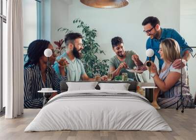 Group of multiethnic friends enjoying dinner party Wall mural