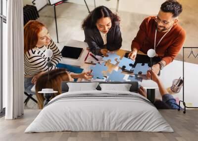 Group of professional people playing puzzle in the office.Team Building Wall mural