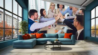 Large business team showing unity with their hands together. Selective focus Wall mural